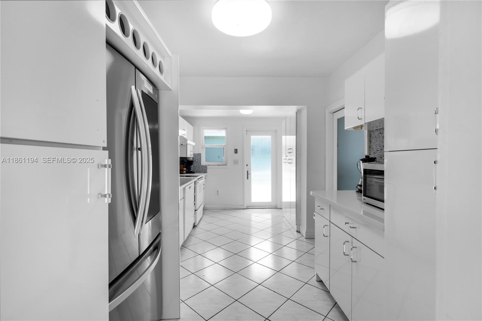 520 Southwest 22nd Road Miami, FL 33129 - Photo 26 of 71 a kitchen with stainless steel appliances a refrigerator and a sink