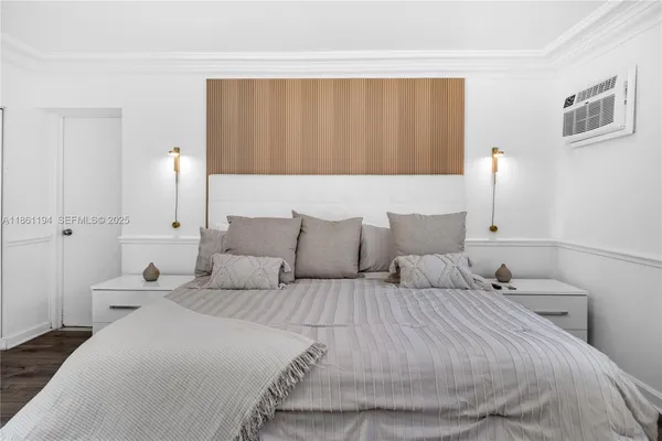 a bedroom with bed and window