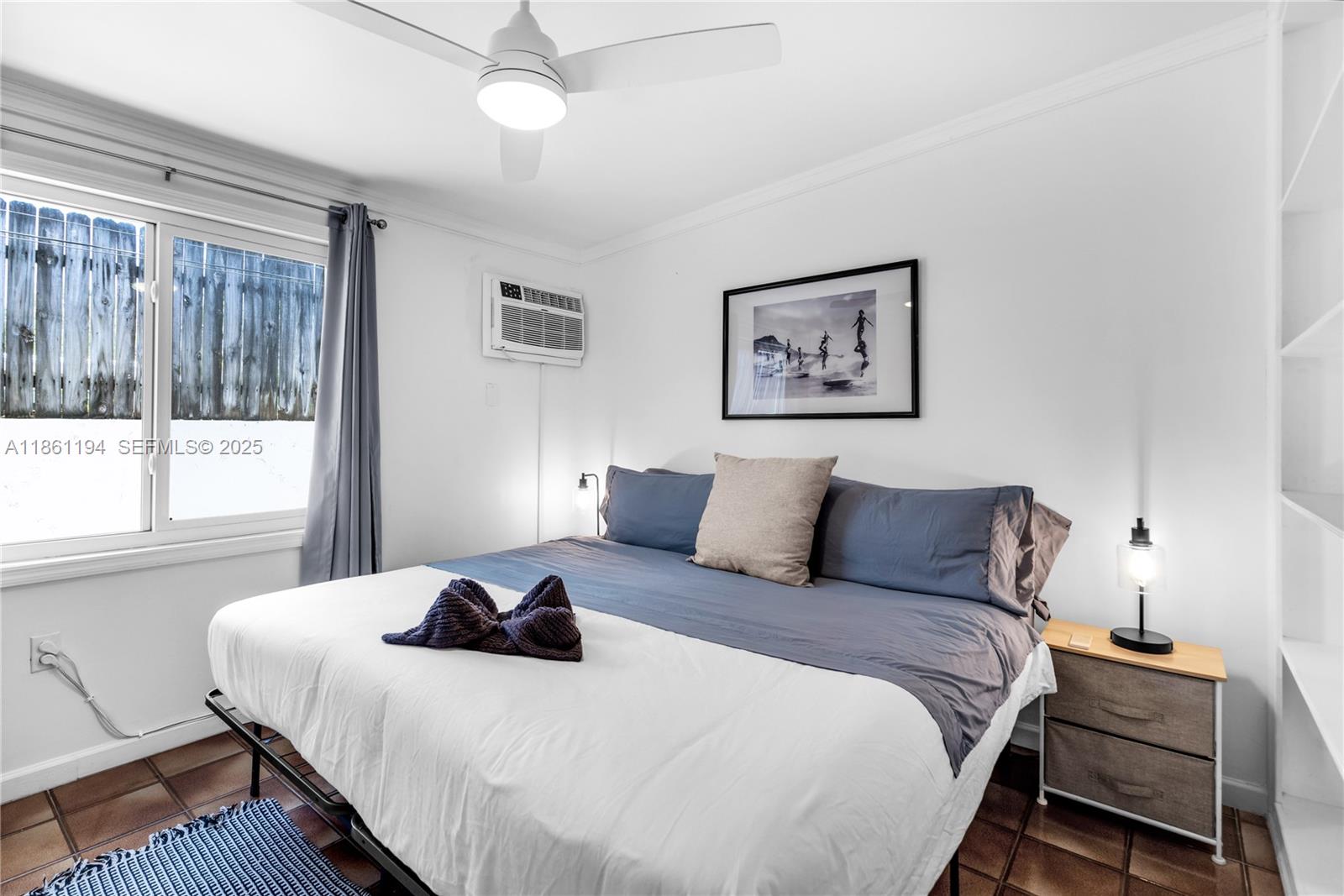 520 Southwest 22nd Road Miami, FL 33129 - Photo 37 of 71 a bedroom with a bed and a window