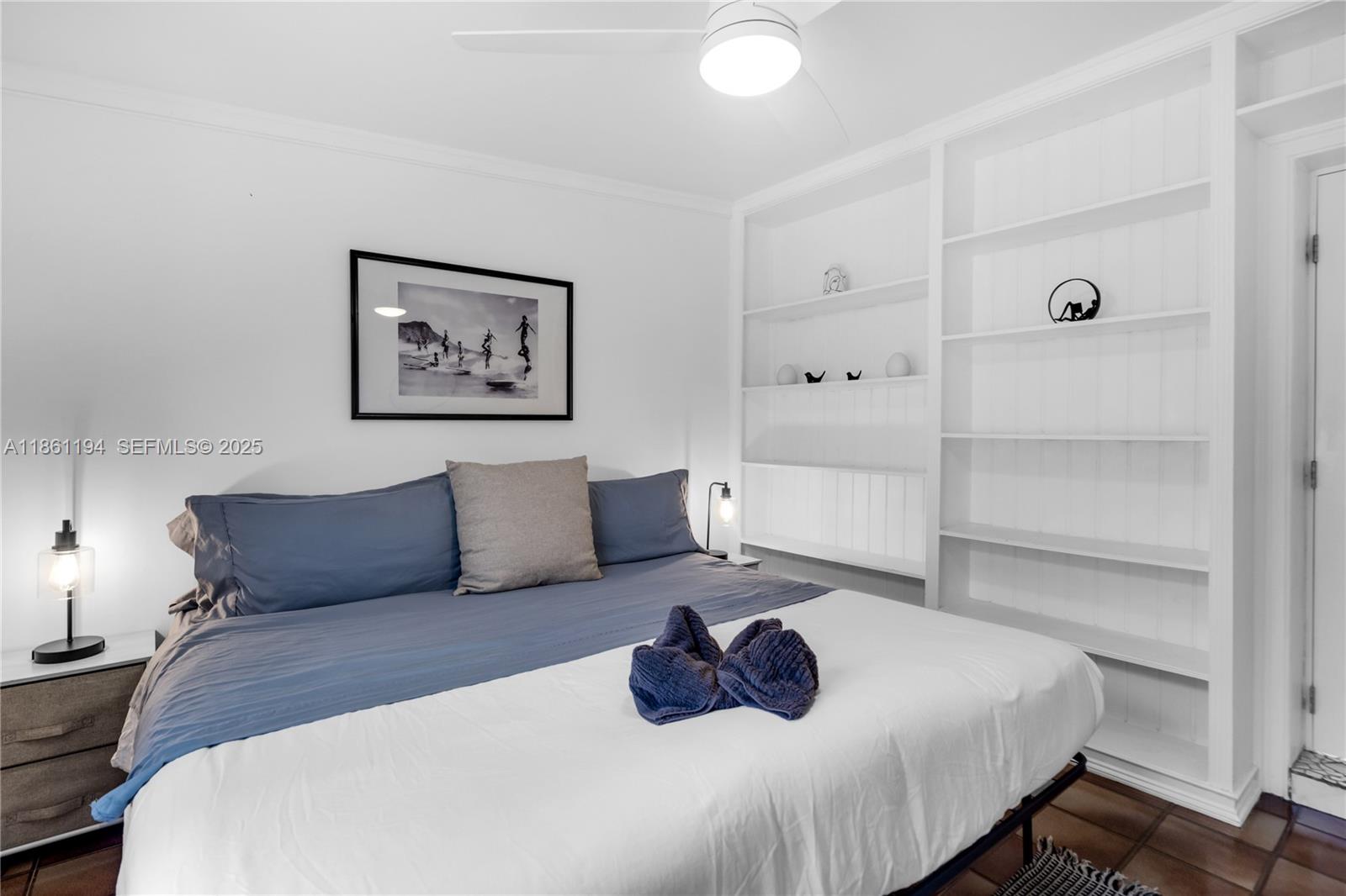 520 Southwest 22nd Road Miami, FL 33129 - Photo 38 of 71 a bedroom with a bed and a couch