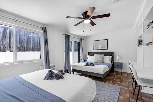 a bedroom with a bed and a couch