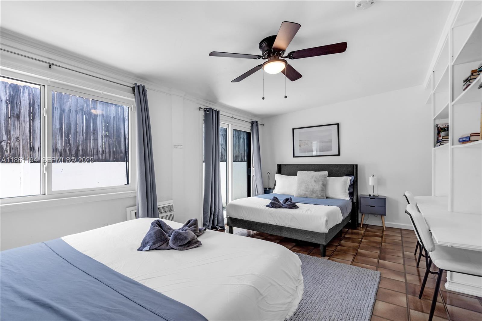 520 Southwest 22nd Road Miami, FL 33129 - Photo 41 of 71 a bedroom with furniture and a window