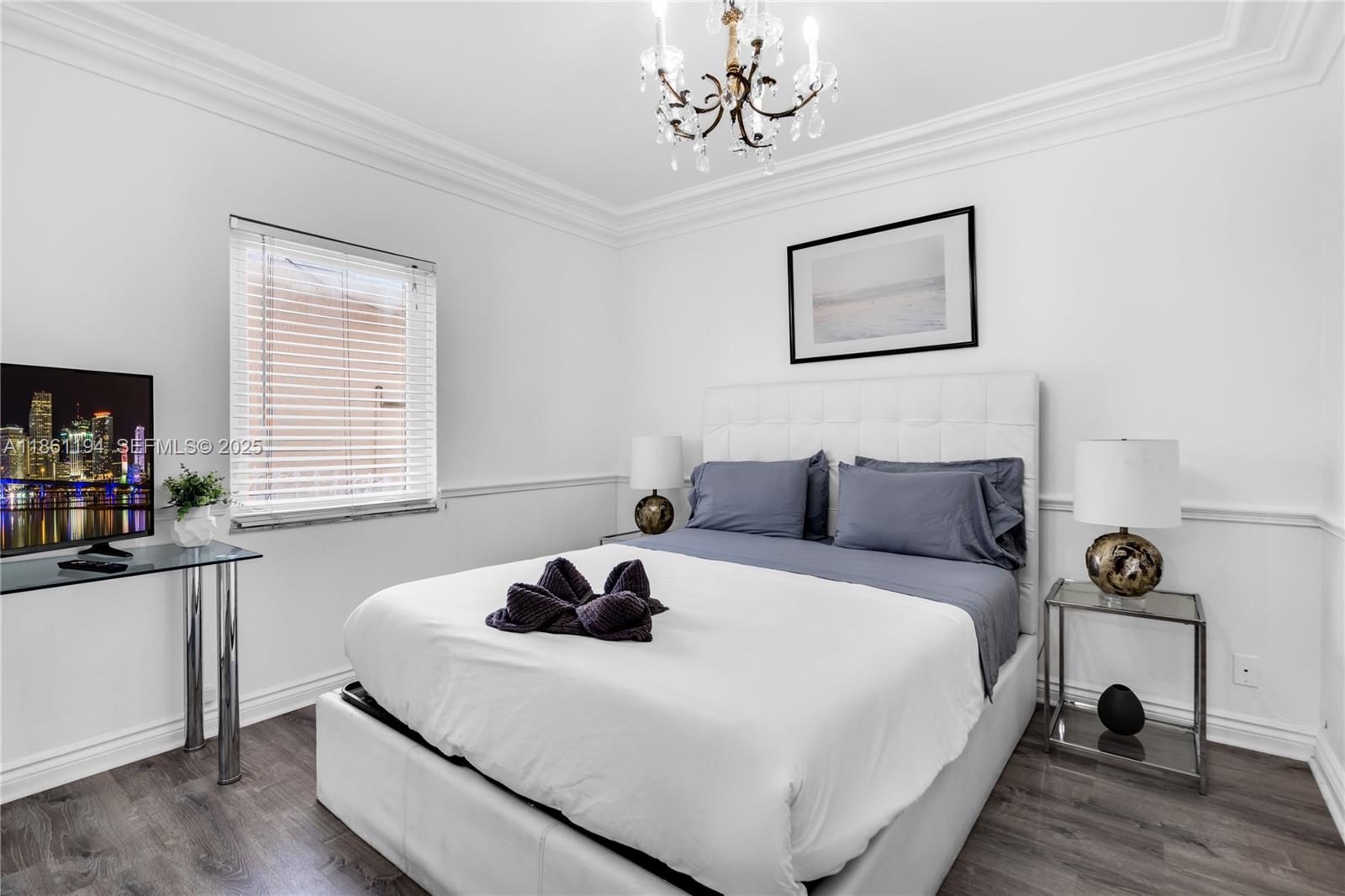 520 Southwest 22nd Road Miami, FL 33129 - Photo 42 of 71 a bedroom with bed and window