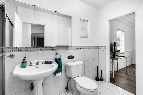 a utility room with cabinets washer and dryer