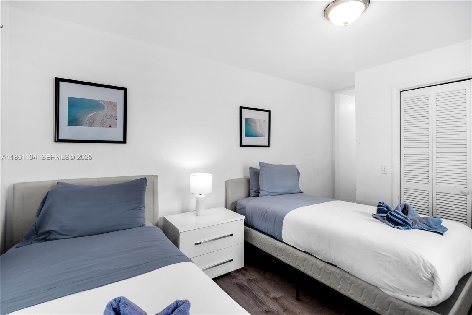 520 Southwest 22nd Road Miami, FL 33129 - Photo 55 of 71 a bedroom with a bed and a couch