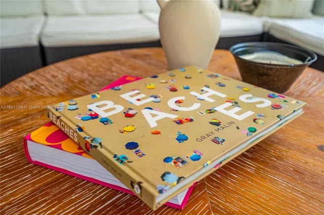 a view of a livingroom with furniture and a potted plant