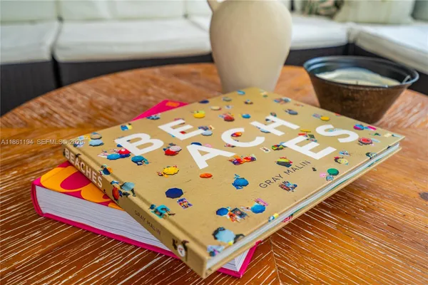 a view of a livingroom with furniture and a potted plant