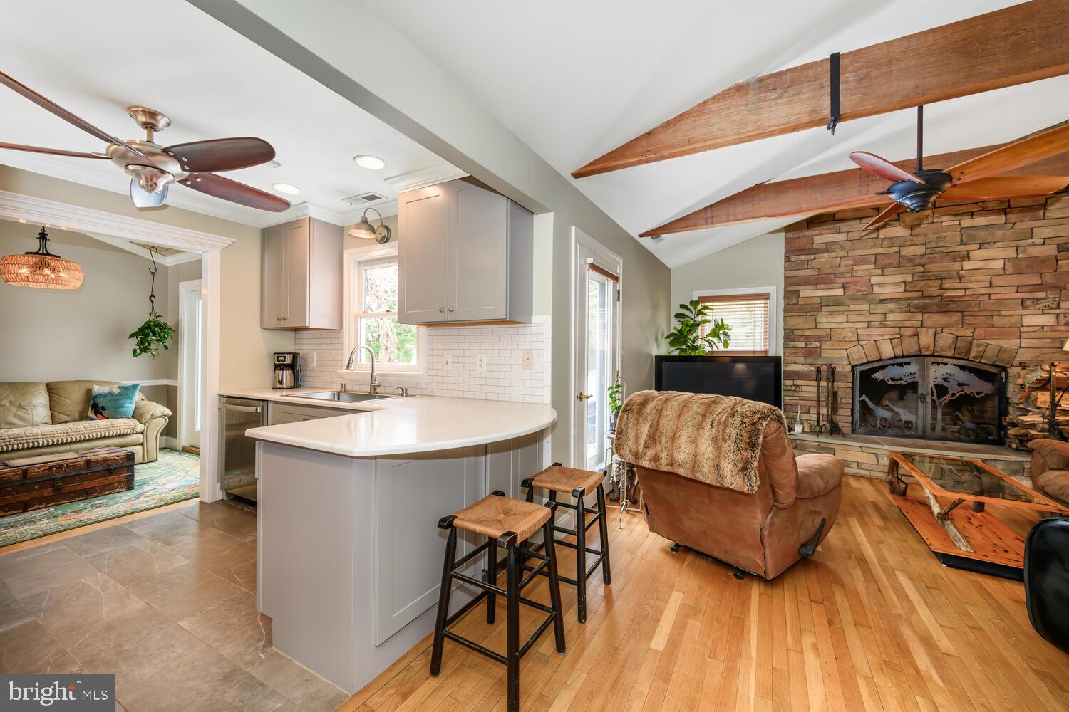 25706 Edgeview Road Royal Oak, MD 21662 - Photo 13 of 31 a living room with furniture and a fireplace