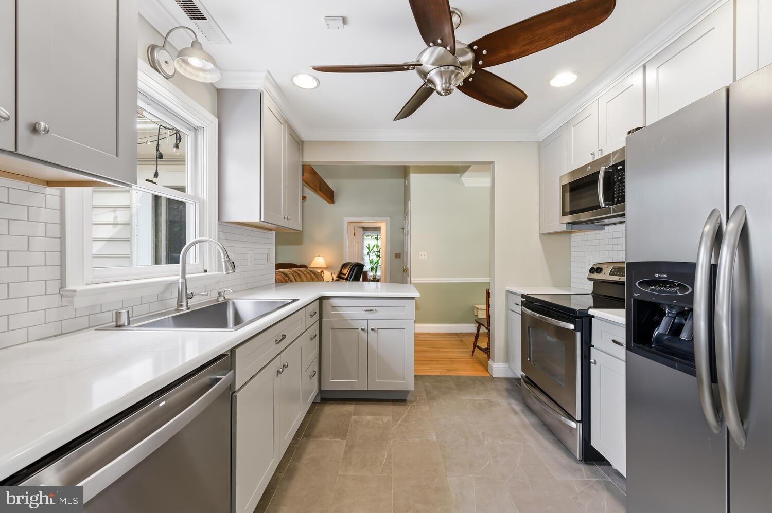 25706 Edgeview Road Royal Oak, MD 21662 - Photo 14 of 31 a kitchen with a sink stainless steel appliances and cabinets