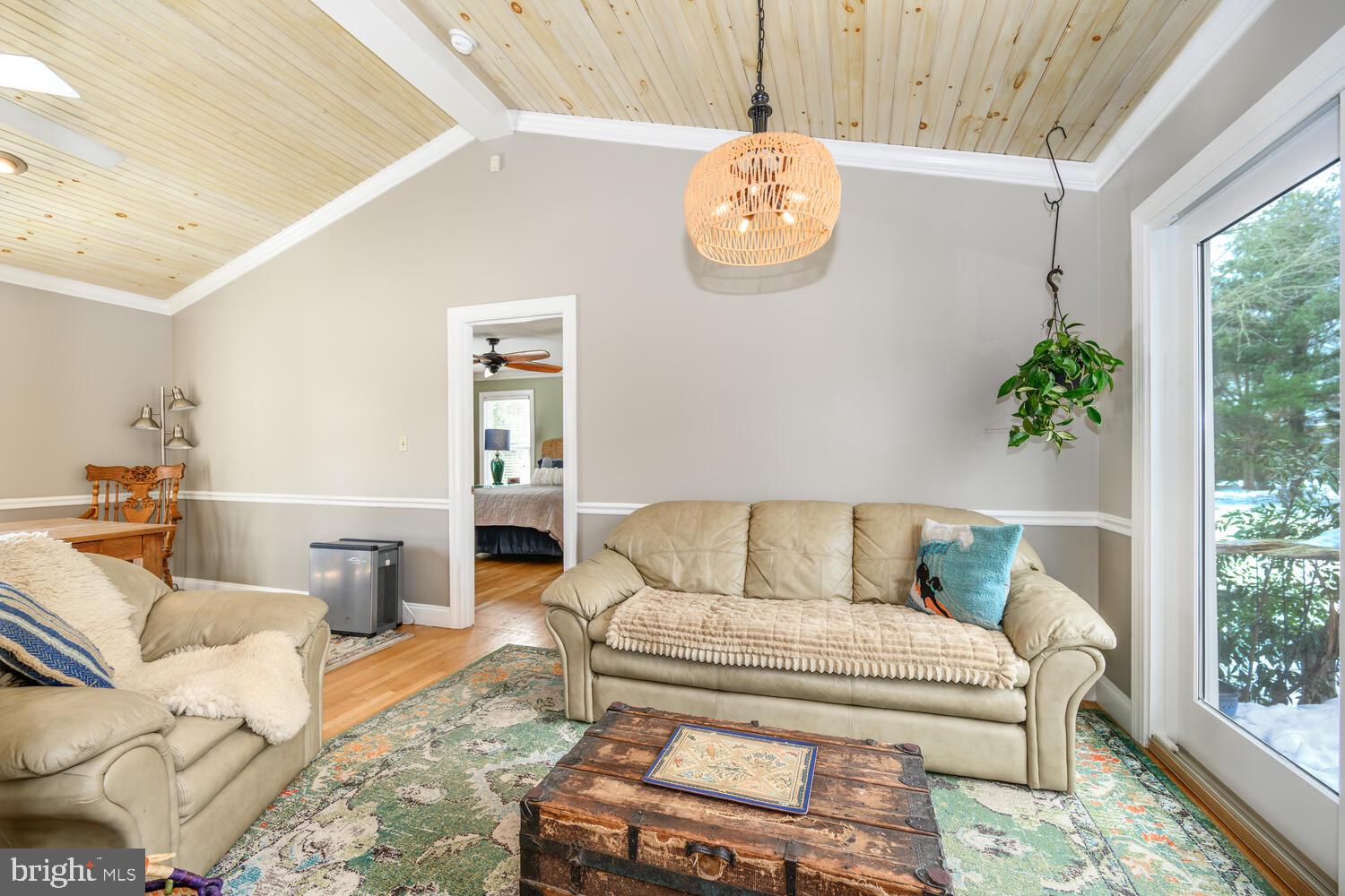 25706 Edgeview Road Royal Oak, MD 21662 - Photo 17 of 31 a living room with furniture and a large window