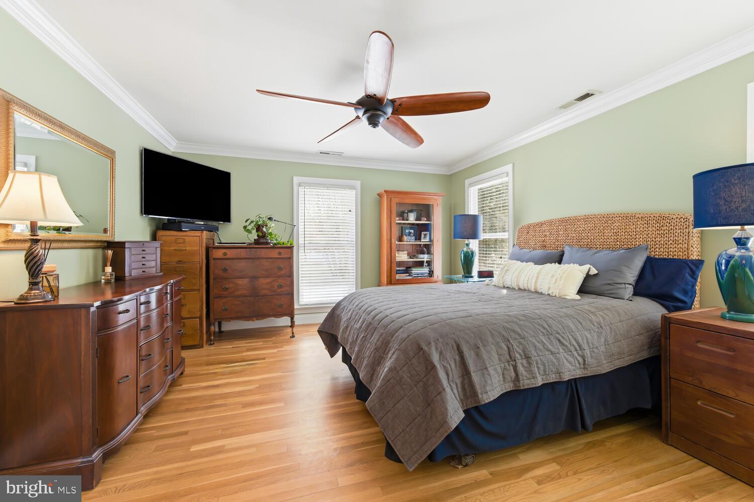 25706 Edgeview Road Royal Oak, MD 21662 - Photo 24 of 31 a spacious bedroom with a bed and a flat screen tv