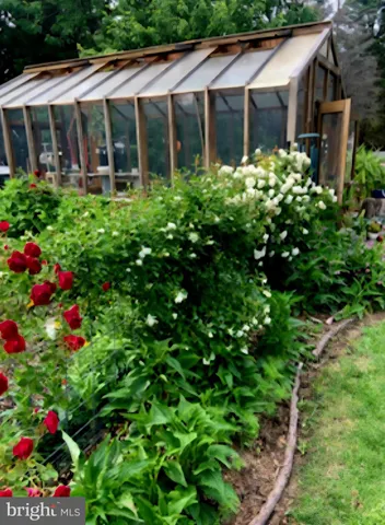 a house view with sitting space and garden space