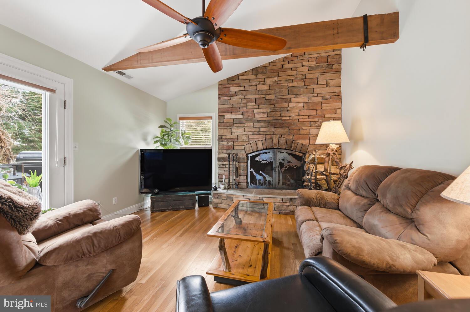 25706 Edgeview Road Royal Oak, MD 21662 - Photo 10 of 31 a living room with furniture and a fireplace