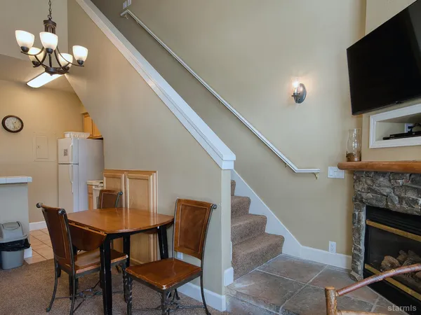 a spacious bathroom with a shower a mirror and a sink
