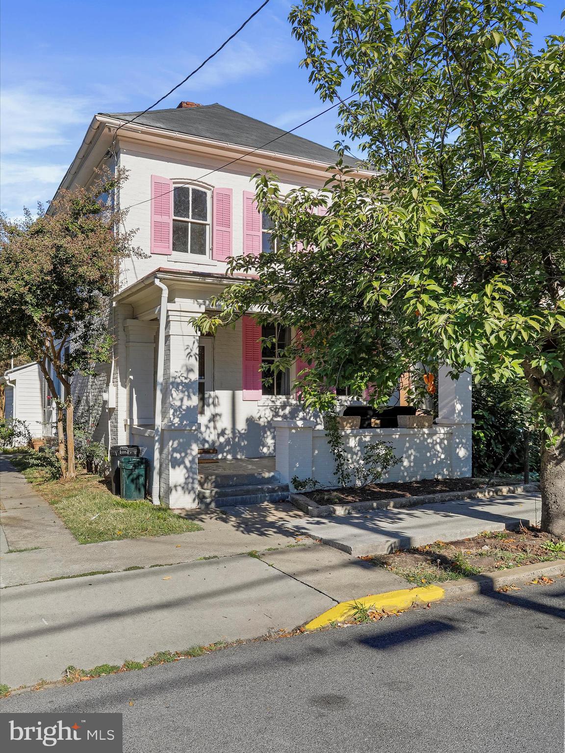 a front view of house with yard swimming pool and outdoor seating