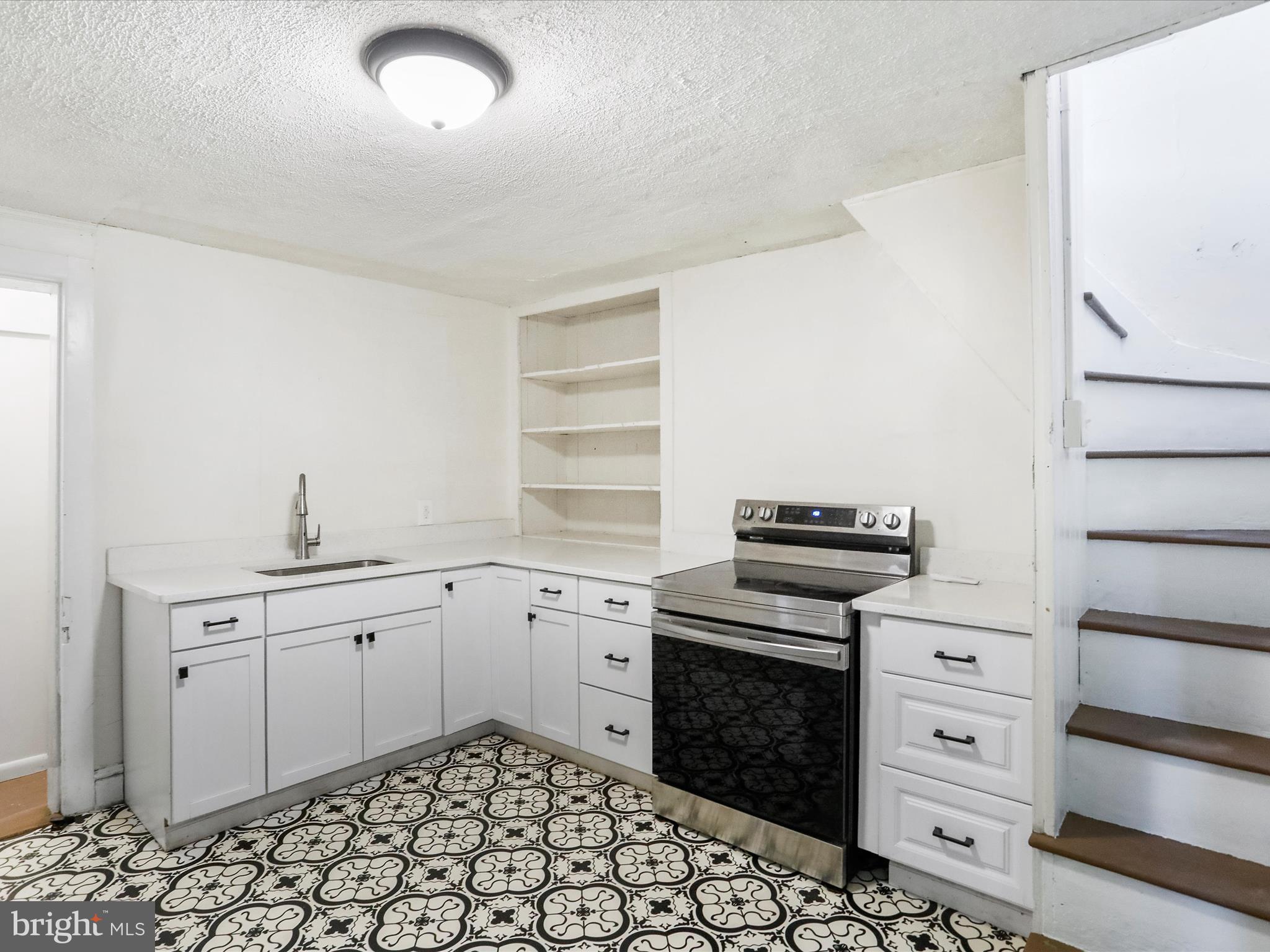 409 South Raleigh Street Martinsburg, WV 25401 - Photo 11 of 28 a kitchen with a stove oven and sink