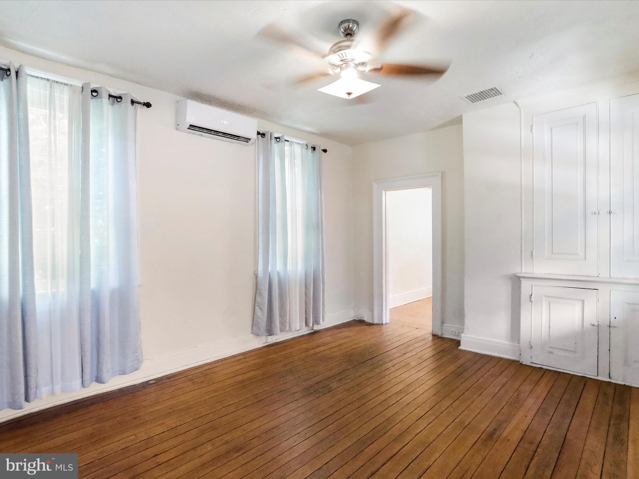 409 South Raleigh Street Martinsburg, WV 25401 - Photo 6 of 28 a view of a room with wooden floor and window
