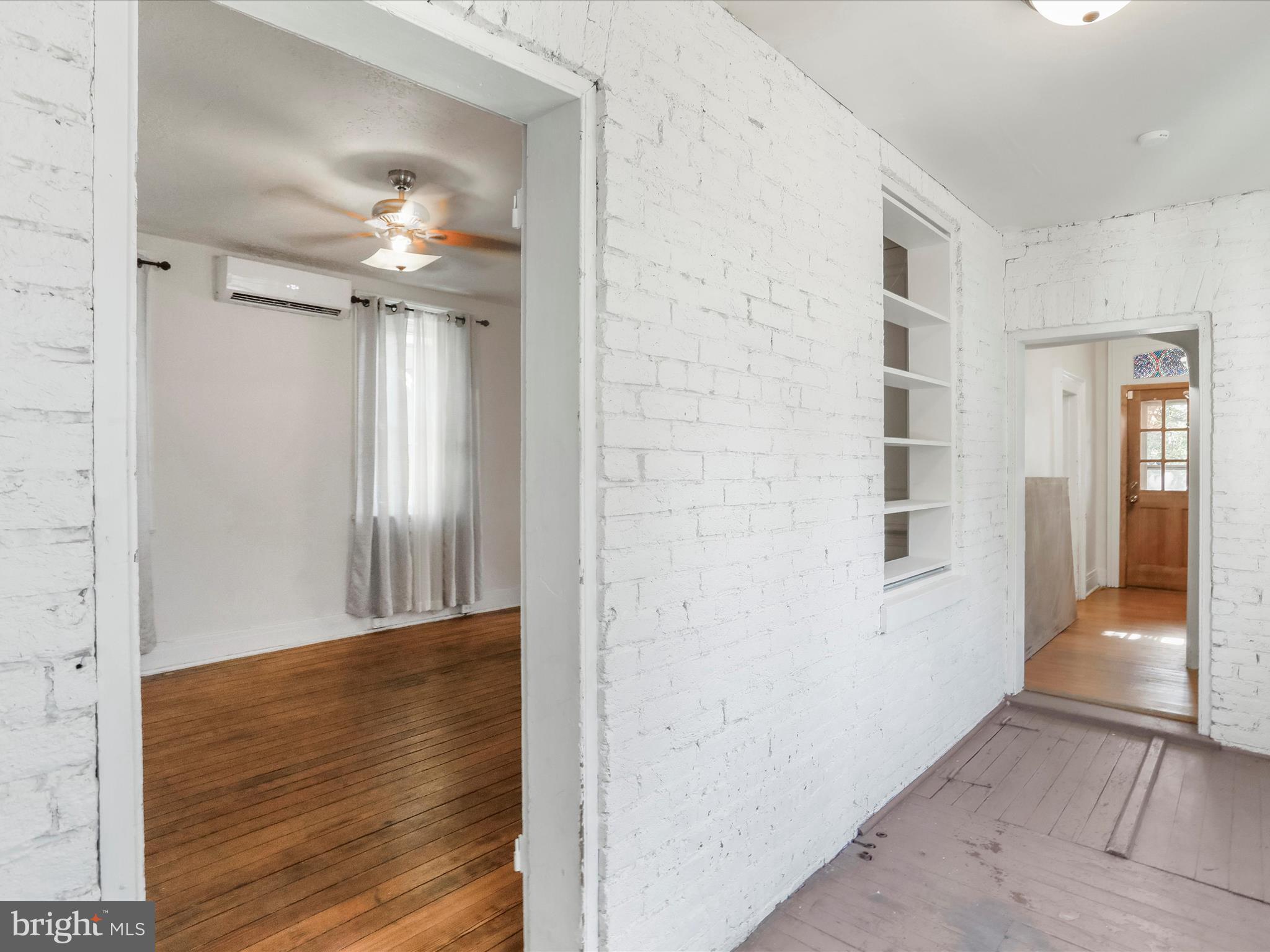 409 South Raleigh Street Martinsburg, WV 25401 - Photo 8 of 28 a view of a hallway with wooden floor