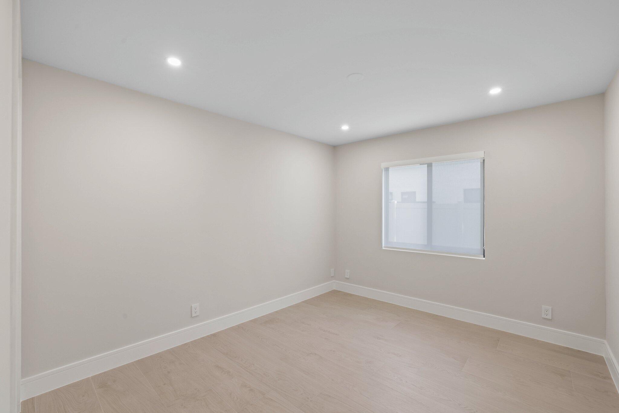 3901 Northwest 27th Avenue Boca Raton, FL 33434 - Photo 44 of 56 an empty room with a window