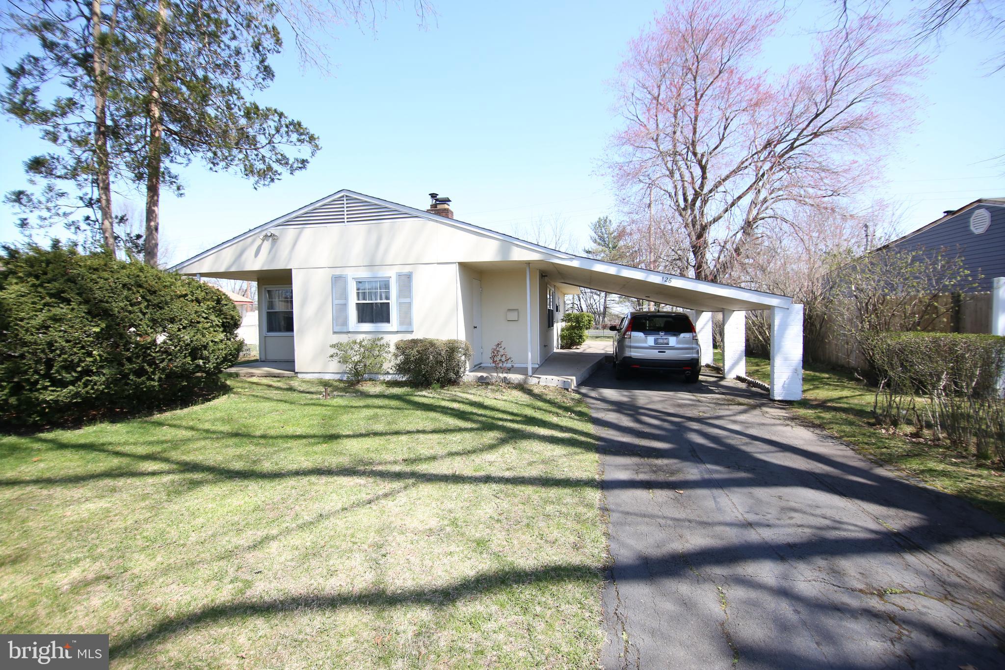 126 Gable Hill Road Levittown, PA 19057 - Photo 1 of 16 a front view of a house with a garden