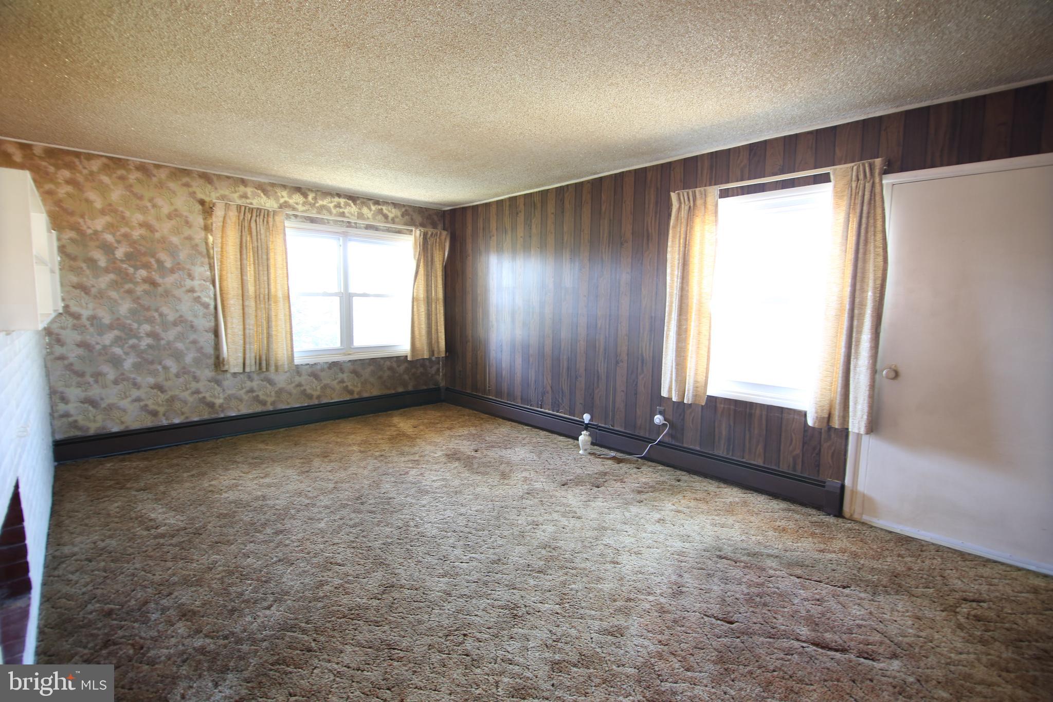 126 Gable Hill Road Levittown, PA 19057 - Photo 4 of 16 an empty room with windows