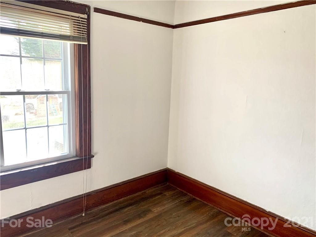 559 Thompson Cove Road Clyde, NC 28721 - Photo 13 of 36 a view of a room with wooden floor and a window
