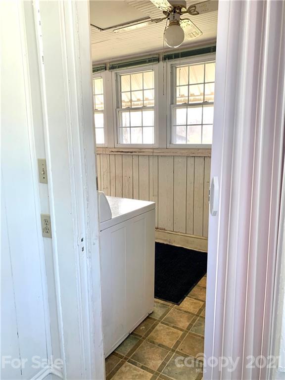559 Thompson Cove Road Clyde, NC 28721 - Photo 24 of 36 a bathroom with a sink and a mirror
