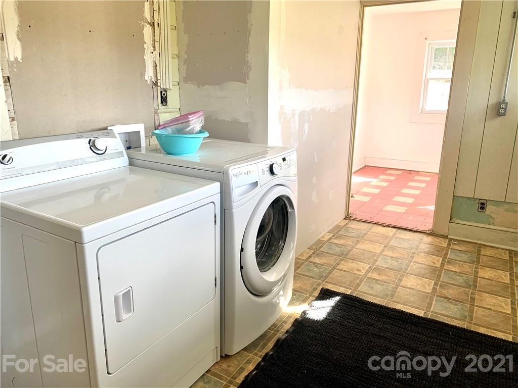 559 Thompson Cove Road Clyde, NC 28721 - Photo 25 of 36 a utility room with dryer and washer