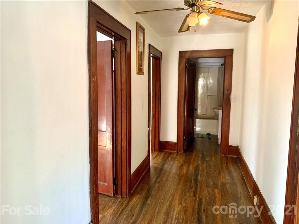559 Thompson Cove Road Clyde, NC 28721 - Photo 10 of 36 a view of a hallway with wooden floor