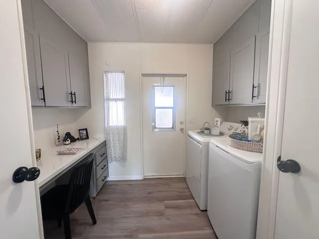 a kitchen with a sink a stove and cabinets