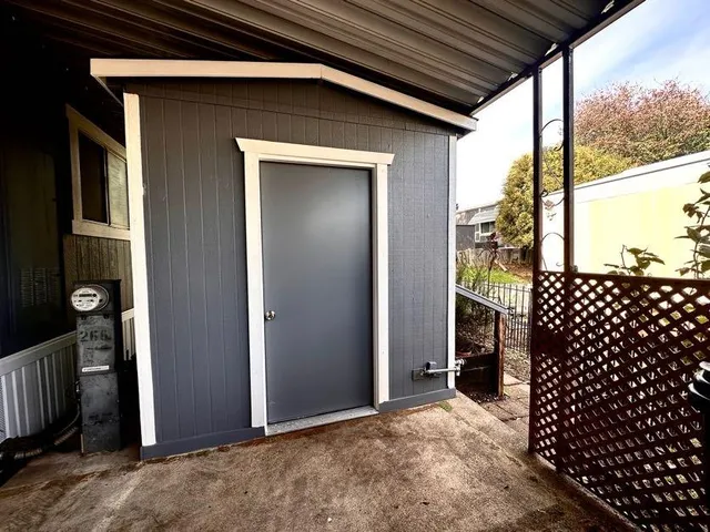 a view of swimming pool with a patio and a garden