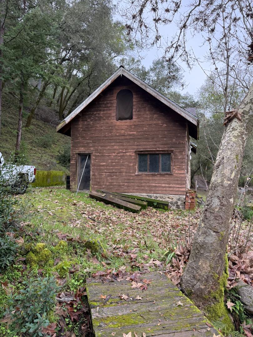 14715 Uvas Road Morgan Hill, CA 95037 - Photo 4 of 11 a backyard of a house with lots of plants and empty space