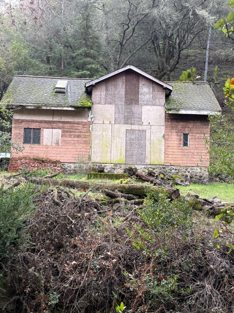 14715 Uvas Road Morgan Hill, CA 95037 - Photo 8 of 11 a front view of a house with a yard