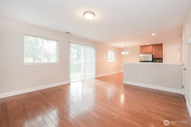 a view of a kitchen with a sink and a window