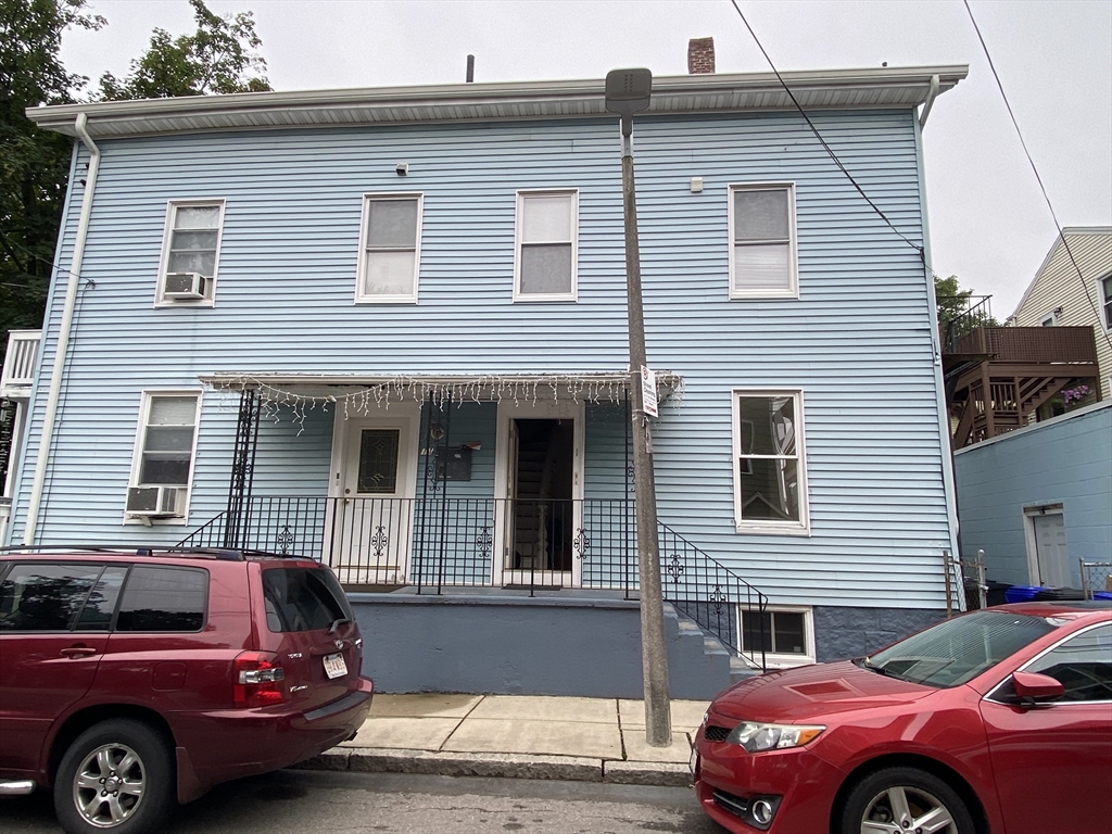 1 Minton Street, Unit 2 Boston, MA 02130 - Photo 12 of 12 a front view of a house with a parking space