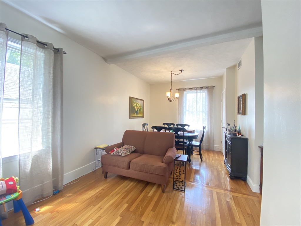 1 Minton Street, Unit 2 Boston, MA 02130 - Photo 5 of 12 a living room with furniture and wooden floor