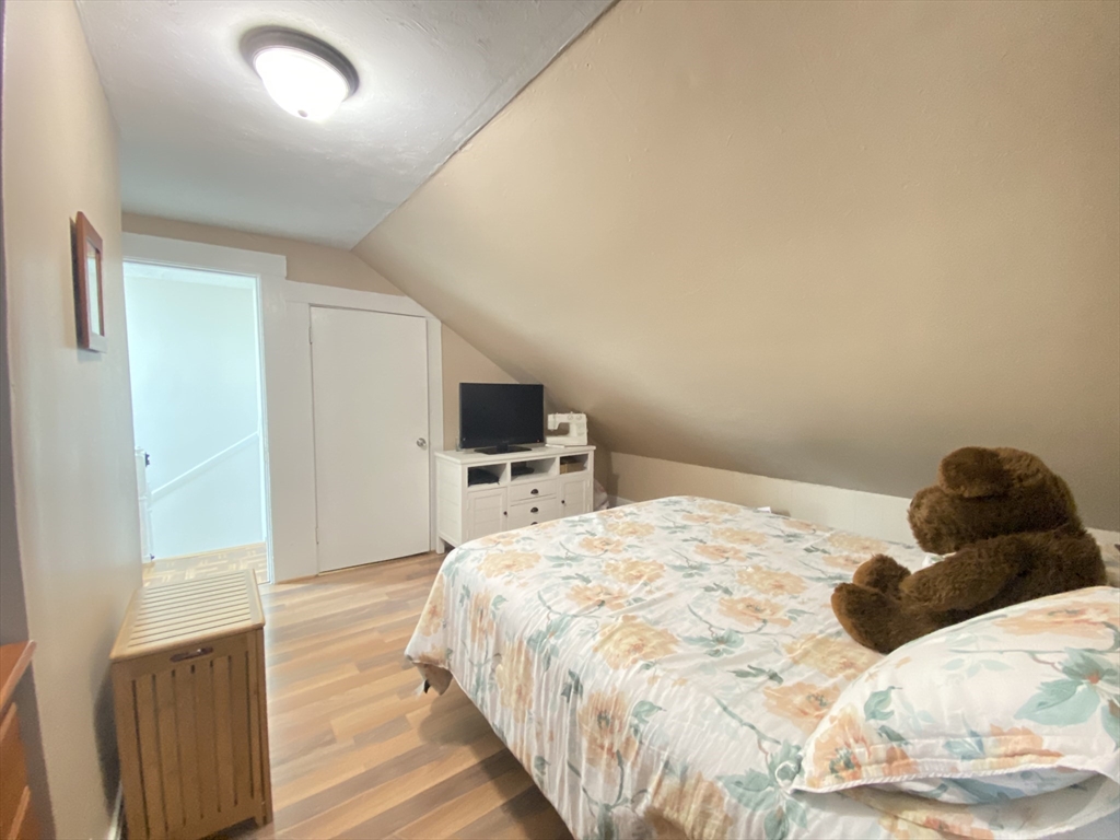 1 Minton Street, Unit 2 Boston, MA 02130 - Photo 10 of 12 a bedroom with a bed and a television