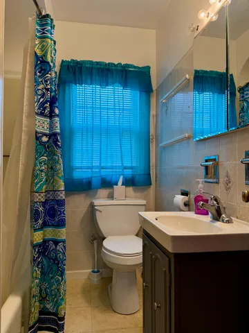 a bathroom with a sink toilet and vanity