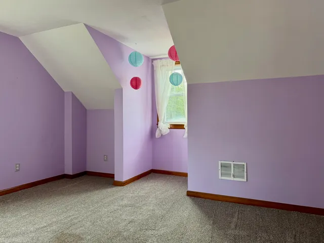 a room with a window and mirror