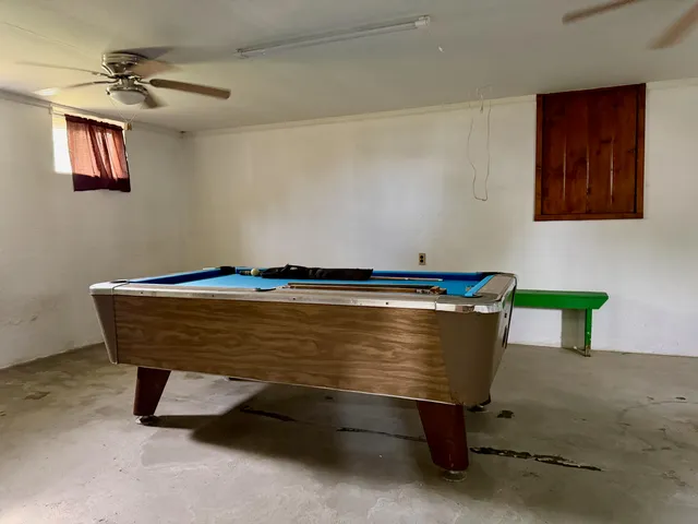 a front view of a house with a garden and plants