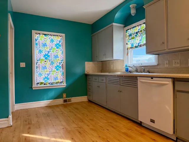 a kitchen with cabinets a window and a sink