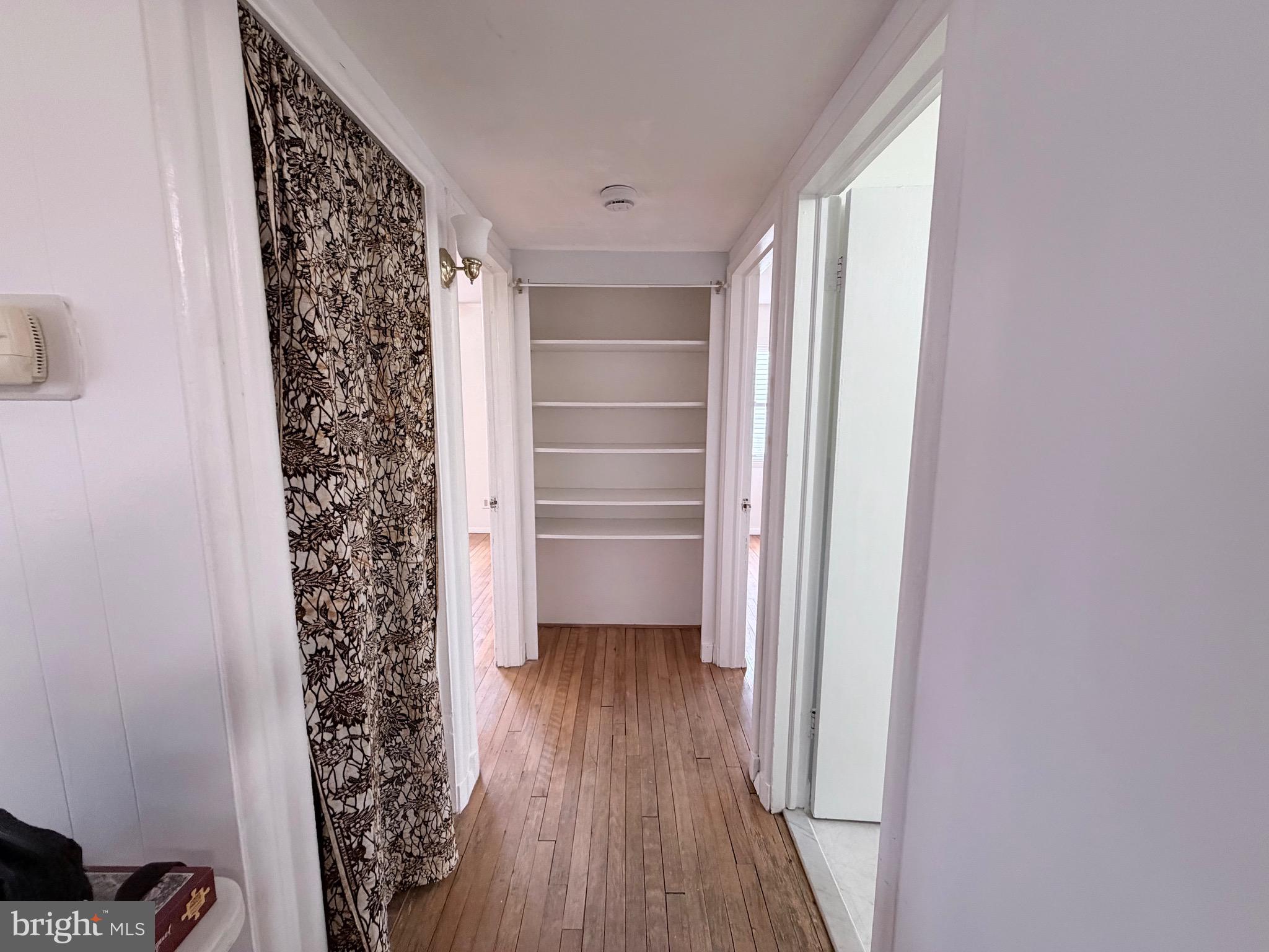 2207 Luzerne Avenue Silver Spring, MD 20910 - Photo 11 of 39 a view of walk in closet with wooden floor