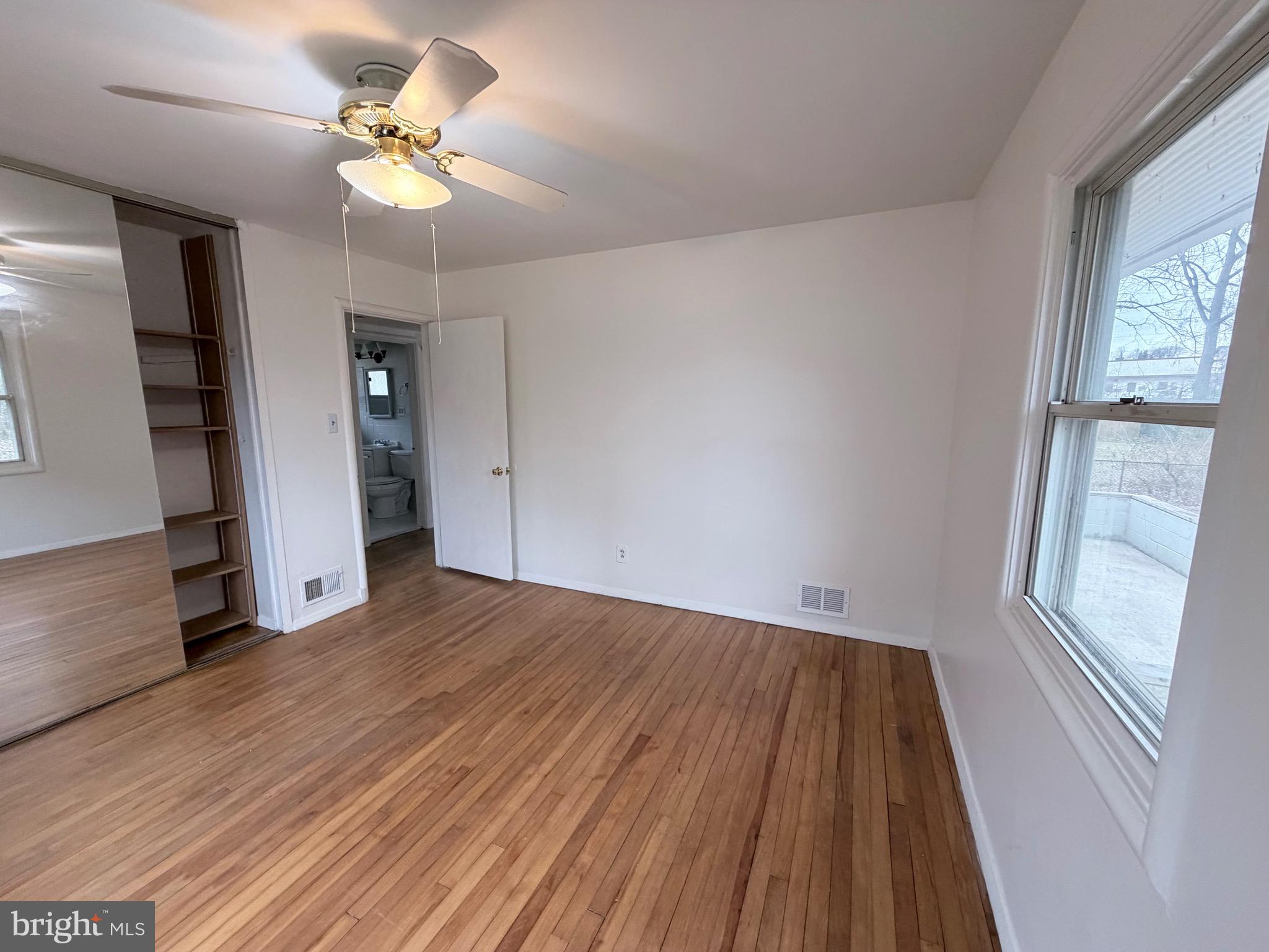 2207 Luzerne Avenue Silver Spring, MD 20910 - Photo 13 of 39 wooden floor in an empty room with a window
