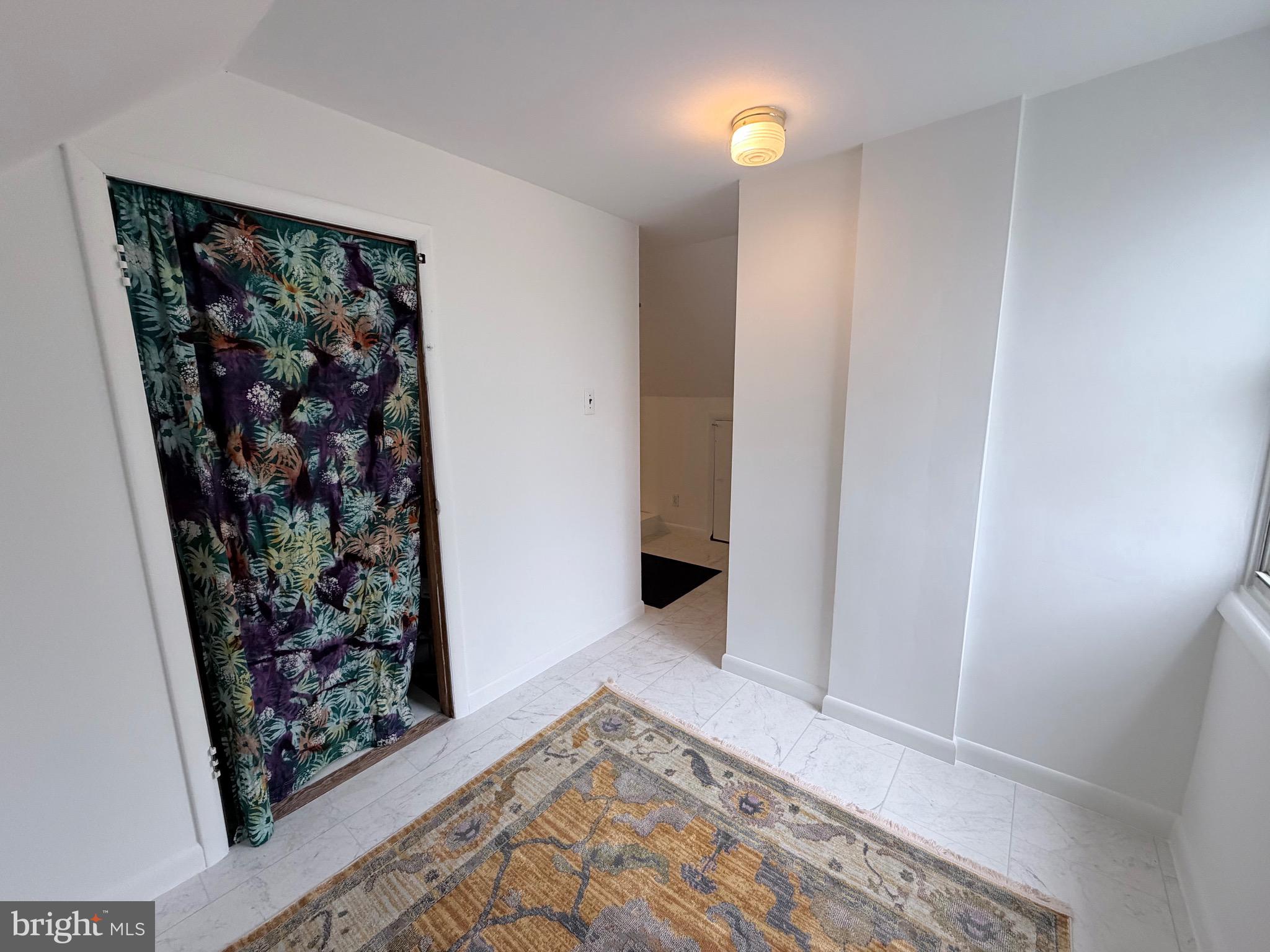2207 Luzerne Avenue Silver Spring, MD 20910 - Photo 25 of 39 a view of a hallway with wooden floor and closet
