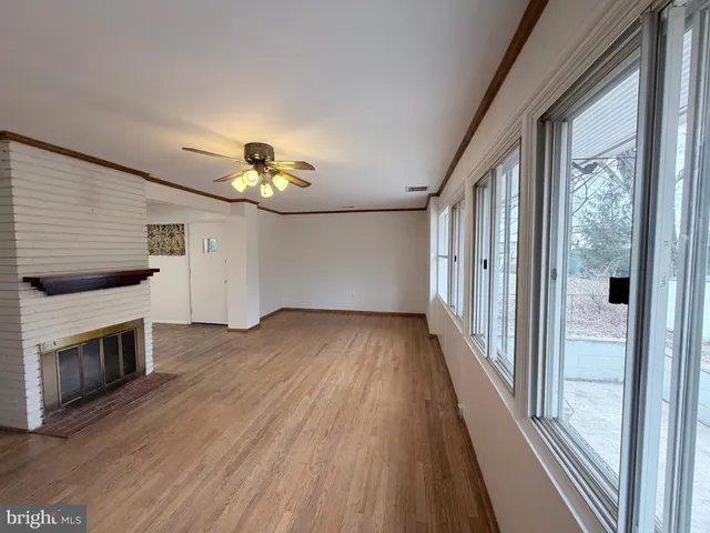 a view of livingroom with furniture wooden floor and window