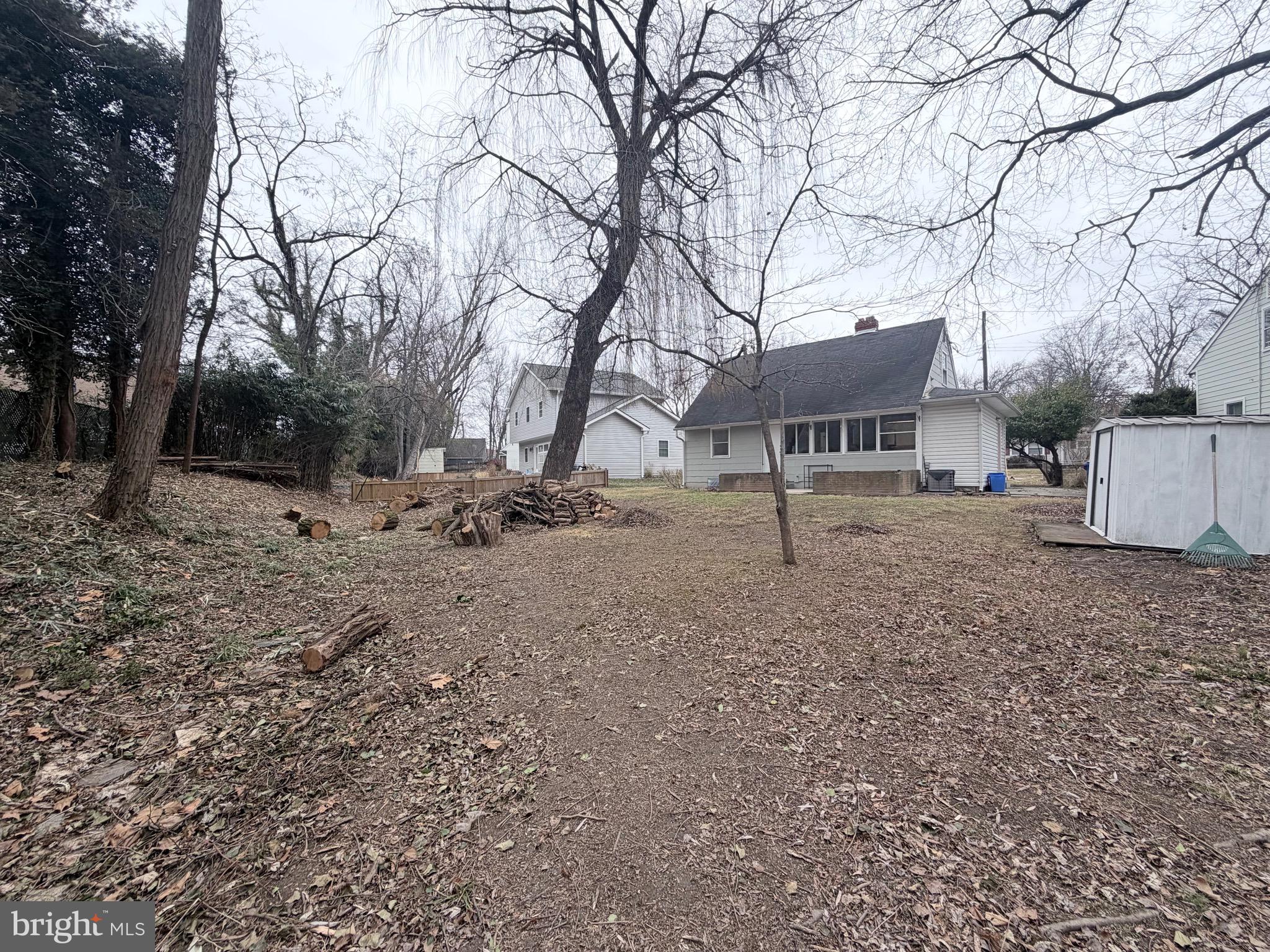 2207 Luzerne Avenue Silver Spring, MD 20910 - Photo 32 of 39 a backyard of a house with fire pit and trees