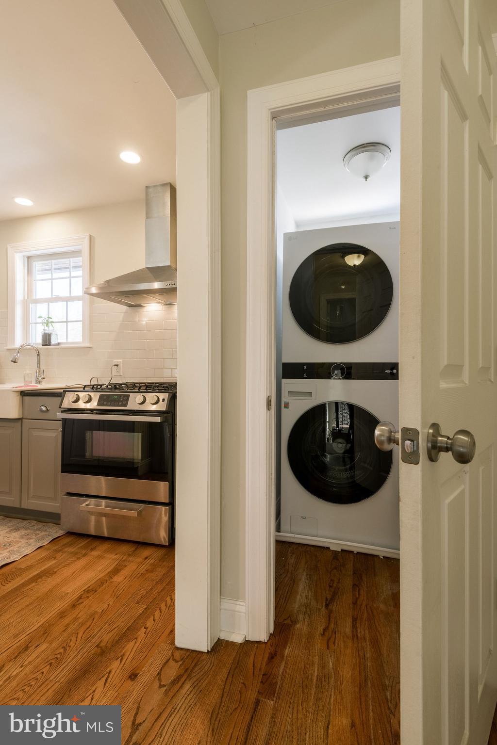 25 North Rolling Road Springfield, PA 19064 - Photo 18 of 45 a kitchen with a stove and a wooden floor