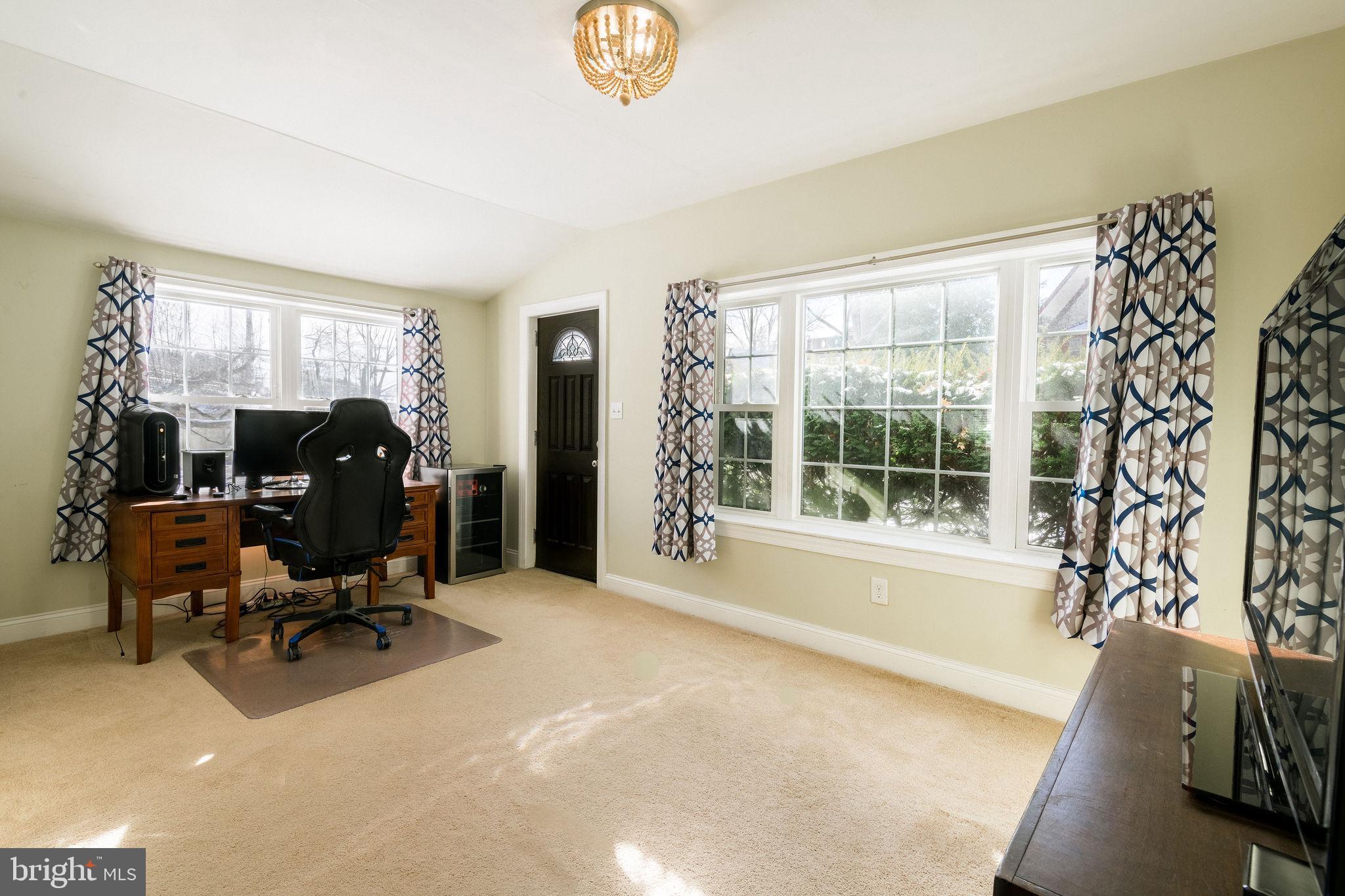 25 North Rolling Road Springfield, PA 19064 - Photo 19 of 45 a view of a livingroom with workspace and a window