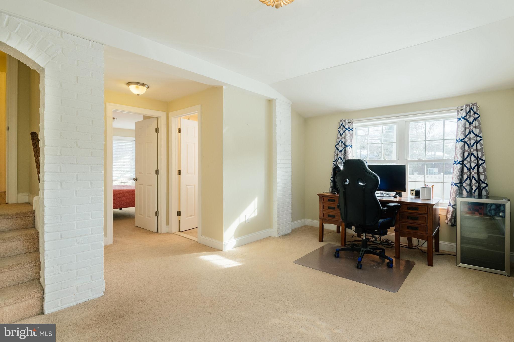 25 North Rolling Road Springfield, PA 19064 - Photo 21 of 45 a view of a livingroom with workspace and a window