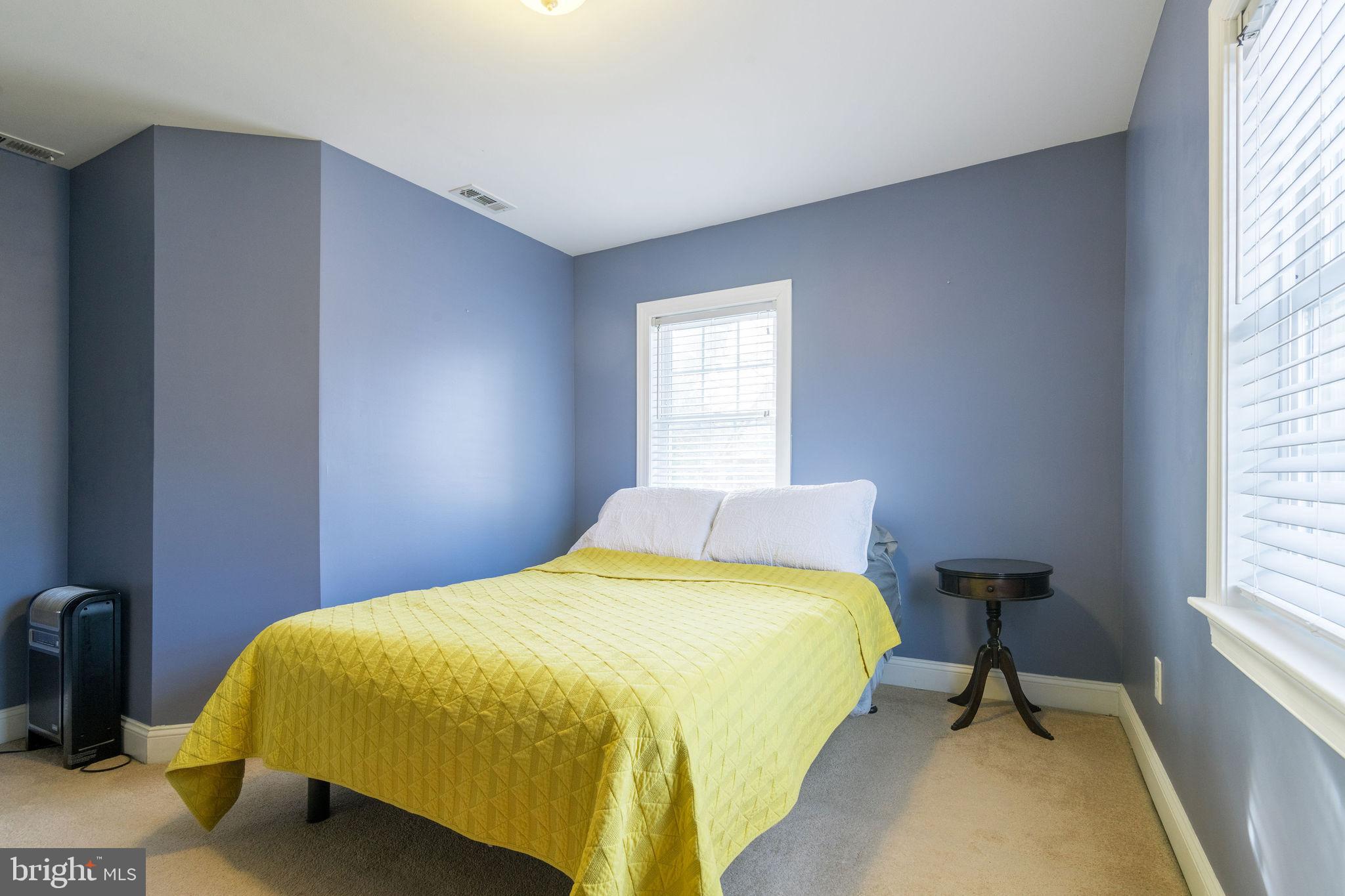 25 North Rolling Road Springfield, PA 19064 - Photo 36 of 45 a bedroom with a bed and a window